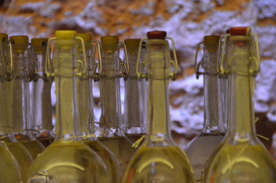 Close-up of oil bottles at market stall