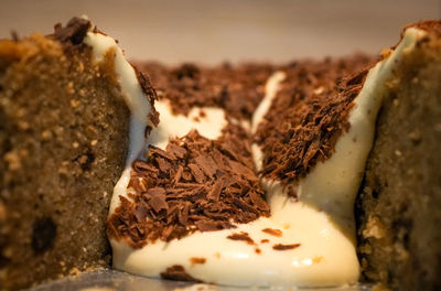 Close-up of ice cream flowing down pastry