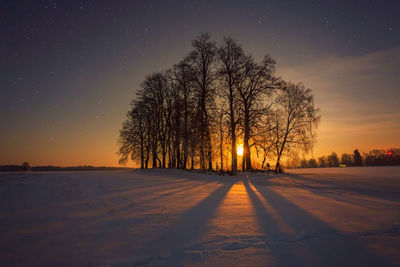Scenic view of landscape against sky at night