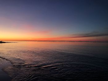 Scenic view of sea against sky at sunset