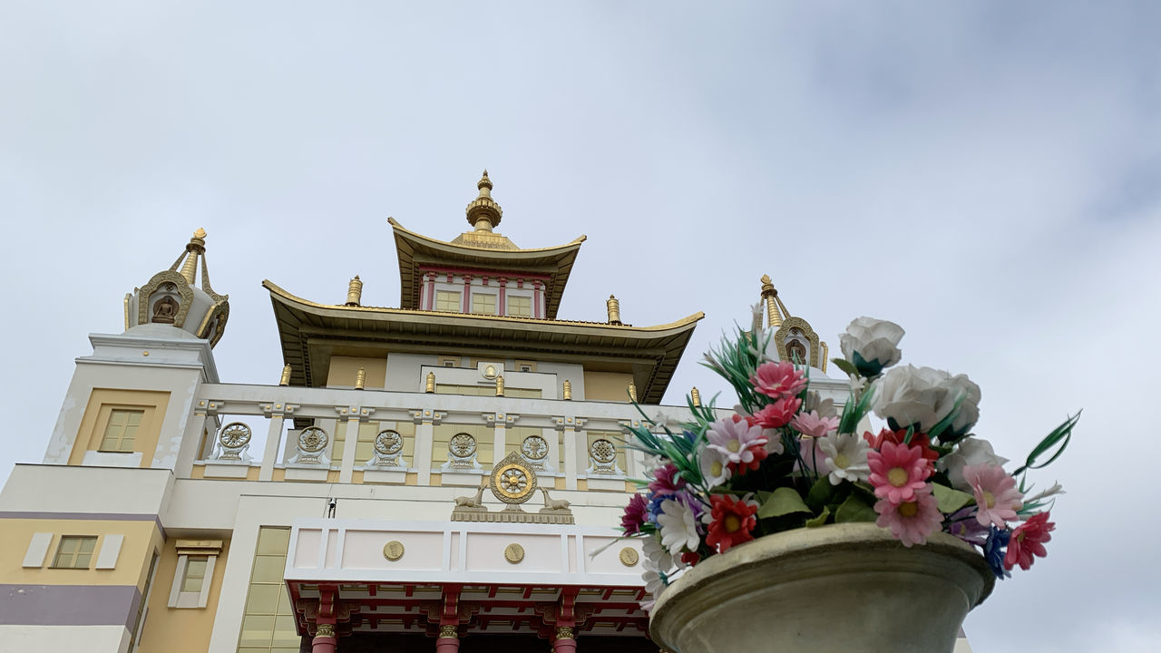 architecture, built structure, building exterior, low angle view, sky, nature, flower, building, plant, flowering plant, no people, day, outdoors, belief, religion, decoration, spirituality, art and craft, potted plant, place of worship, ornate