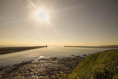 Sunrise over the entrance to tynemouth harbour in tyne and wear, uk