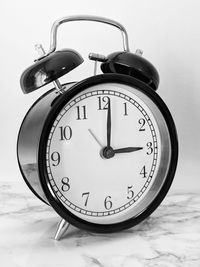 Close-up of clock on table