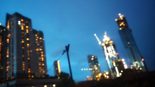 Illuminated buildings in city at night