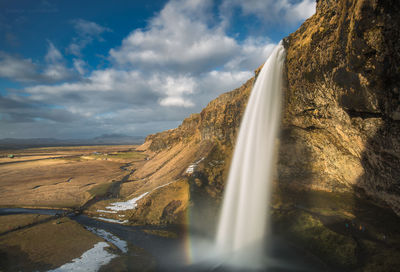 View of waterfall against sky