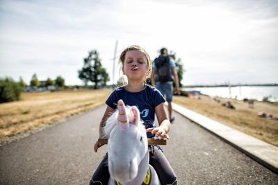Child sitting on rocking horse