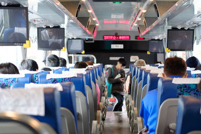 Rear view of people in bus
