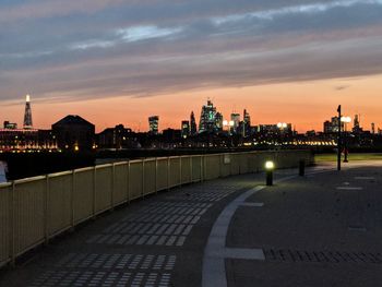 Illuminated city buildings at dusk