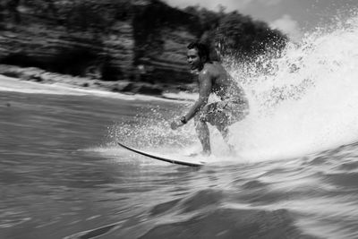 Full length of man surfing in sea