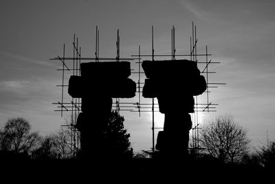 Low angle view of silhouette people against the sky