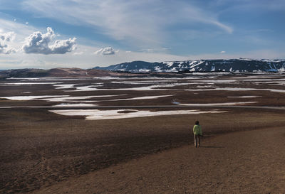 Man on beach against sky