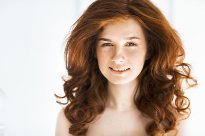 Portrait of a beautiful young woman over white background