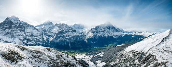 Scenic view of snowcapped mountains against sky