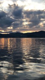 Scenic view of lake against sky during sunset