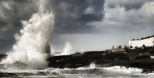 Panoramic view of sea against storm clouds