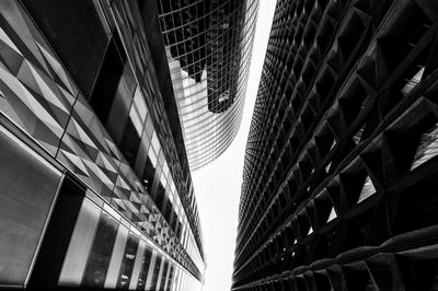 Low angle view of buildings in city against sky