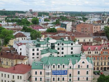Houses in city against sky
