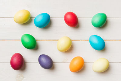 Close-up of multi colored marbles on white background