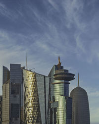 Low angle view of buildings in city against sky