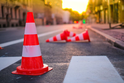 Close-up of red wine on road in city