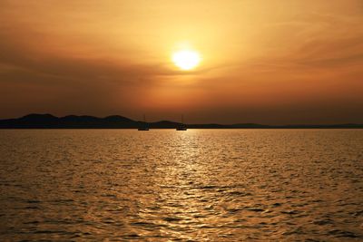 Scenic view of sea at sunset