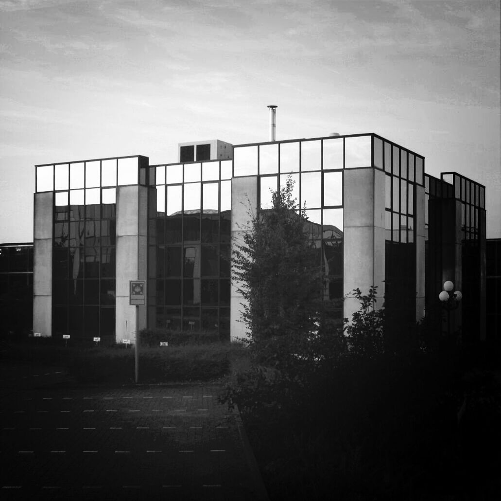 architecture, built structure, building exterior, sky, window, building, city, day, outdoors, sunlight, no people, cloud - sky, shadow, residential building, residential structure, silhouette, cloud, exterior, history, facade