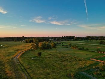 Scenic view of landscape against sky during sunset