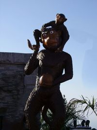 Low angle view of statue against clear sky