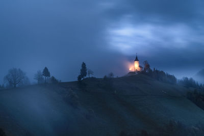 Low angle view of mountain against sky at night