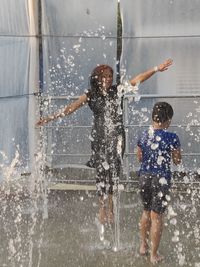 Full length of people enjoying in water