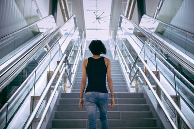 Rear view of woman using mobile phone