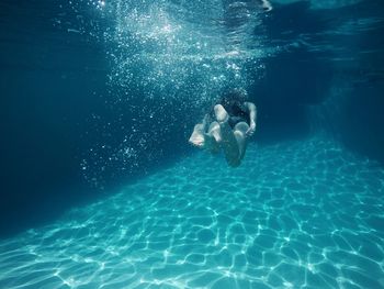 Woman swimming in sea