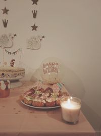 High angle view of cake on table against wall