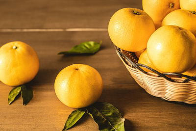 Close-up of fruits in basket on table