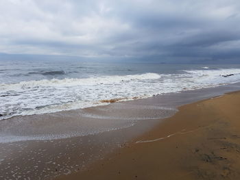 Scenic view of beach against sky