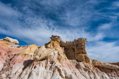 Low angle view of rock formation against sky