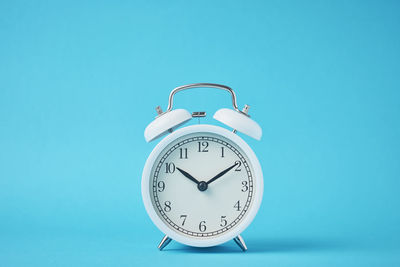 Clock tower against blue background