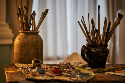 Different artist's accessories on table