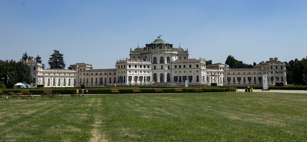 Facade of historic building against clear sky