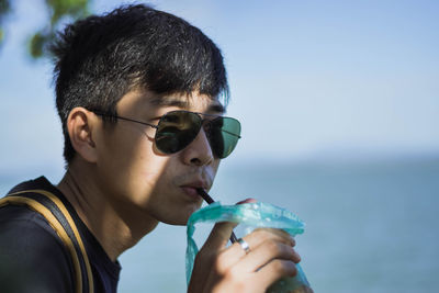 Young man having drink