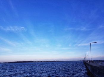 Scenic view of sea against blue sky