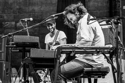 Panoramic shot of people sitting on stage