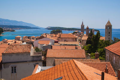 Houses in town against clear sky