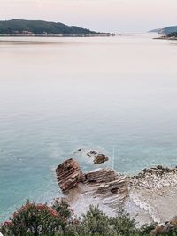 High angle view of rocks on beach against sky