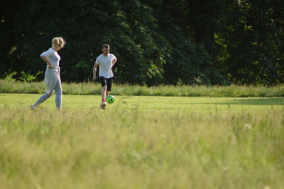Man running on grassy field