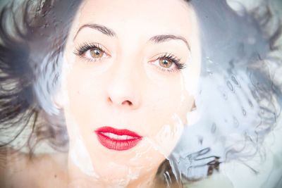 Close-up of young woman in water