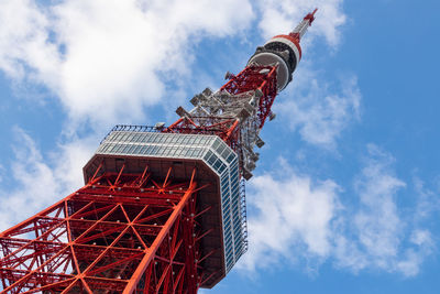 Low angle view of red crane against sky