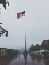 Scenic view of flag against clear sky