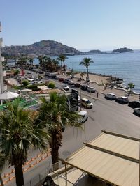 High angle view of palm trees by swimming pool against sky