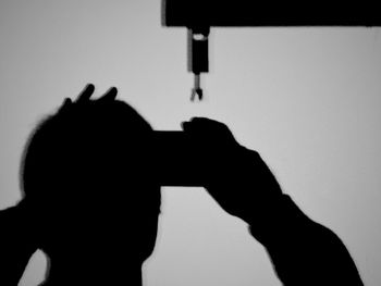 Silhouette of woman in dark background